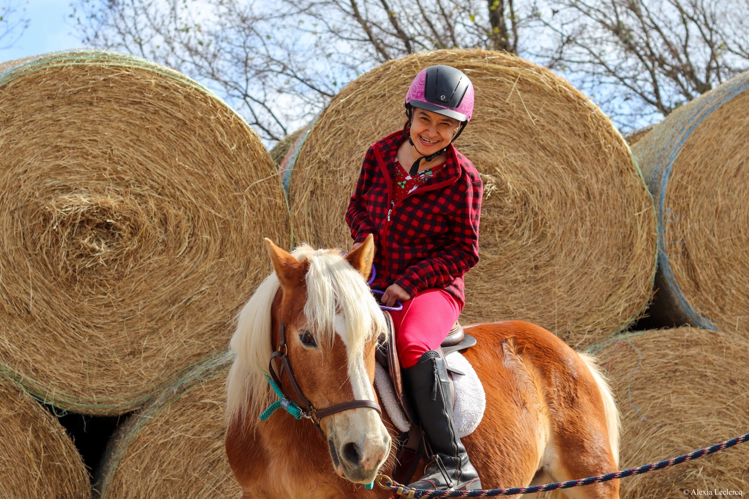 Student and horse, Story, in front of the hay bales.